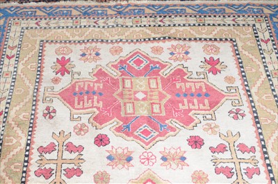 Lot 835 - An North-West Persian Rug, the ivory field...