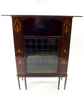 Lot 731 - An Art Nouveau mahogany veneered display cabinet in the manner of Shapland and Petter