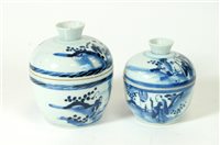 Lot 512 - Two similar graduating 19th century Chinese blue and white porcelain jars and covers