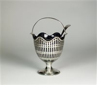 Lot 186 - A silver swing handled sugar basket