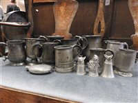 Lot 749 - A collection of pewter drinking vessels and measures etc