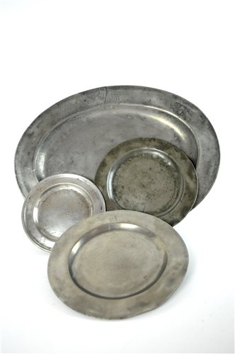 Lot 739 - A large oval pewter dish and nine pewter plates