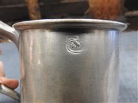 Lot 147 - A collection of twelve 18th and 19th century pewter mugs and measures