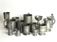 Lot 153 - An assorted collection of 14 pewter drinking vessels, goblets, mugs, measures