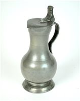 Lot 162 - An 18th century pewter wine flagon