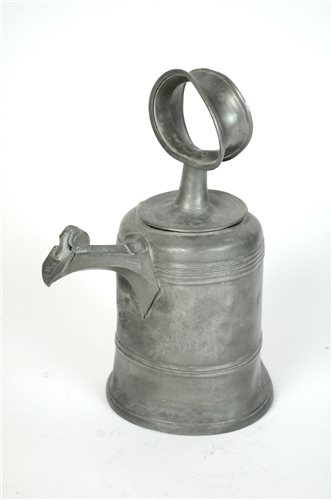 Lot 165 - A mid 18th century Swiss bell shaped pewter wine can or glockenkanne