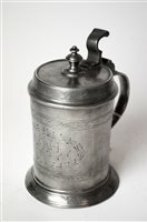 Lot 176 - An 18th century Continental pewter tankard with engraved pattern