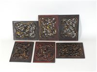 Lot 525 - A set of six Chinese carved and pierced red lacquer and gilt panels