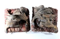 Lot 540 - A pair of Chinese carved and painted wood kylin