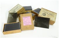 Lot 652 - A collection of boxed early photographic glass plate prints