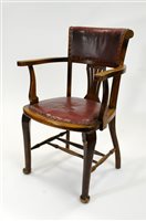 Lot 716 - An Edwardian oak office armchair