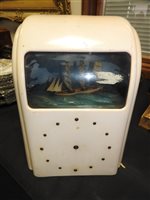 Lot 490 - An Art Deco pink bakelite Vitascope automata clock