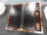 Lot 568 - A mahogany and brass bound campaign desk
