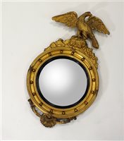 Lot 704 - A mid-19th century convex circular wall mirror