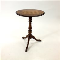 Lot 737 - A small Victorian walnut tripod games table