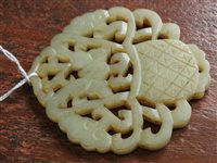 Lot 262 - A Chinese pale green jade openwork plaque