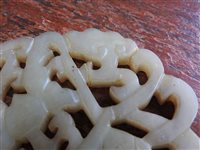 Lot 262 - A Chinese pale green jade openwork plaque