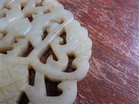 Lot 262 - A Chinese pale green jade openwork plaque