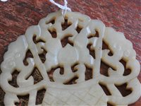 Lot 262 - A Chinese pale green jade openwork plaque