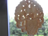 Lot 262 - A Chinese pale green jade openwork plaque