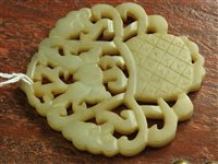 Lot 262 - A Chinese pale green jade openwork plaque