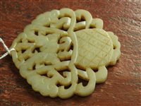 Lot 262 - A Chinese pale green jade openwork plaque