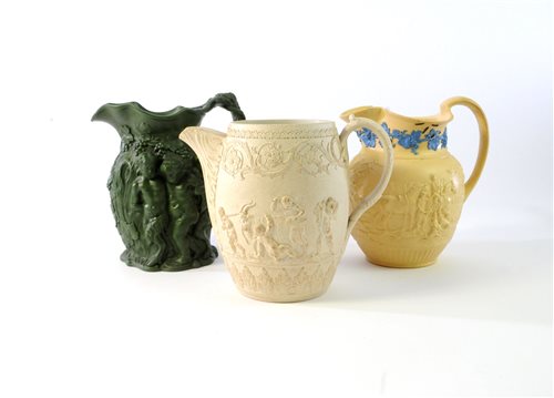 Lot 363 - A collection of 19th century relief moulded jugs