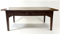 Lot 979 - A rustic 19th century provincial French farmhouse dining table