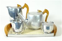 Lot 646 - An associated five-piece Picquot ware tea set