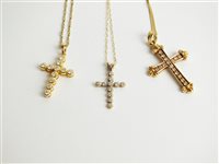 Lot 54 - Three diamond crucifx pendants