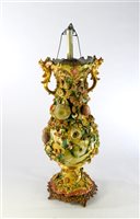 Lot 175 - A large floral encrusted lamp base