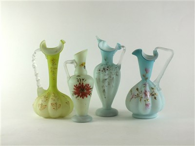 Lot 121 - Four Victorian Burmese glass jugs