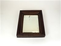 Lot 967 - A decorative 19th century or earlier oak framed pine backed wall mirror