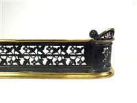 Lot 667 - A good quality Victorian pierced wrought iron and brass framed fire fender