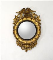 Lot 713 - A 19th century gilt plaster framed circular convex wall mirror
