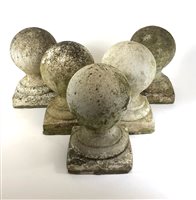 Lot 569 - Architectural salvage, a weathered set of five composite limestone knop finials