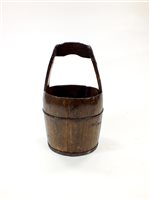 Lot 491 - A rustic Chinese coopered wooden pail