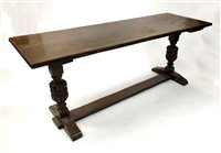 Lot 803 - A rustic stained oak refectory dining table