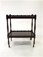 Lot 744 - A two-tier mahogany tea/serving trolley