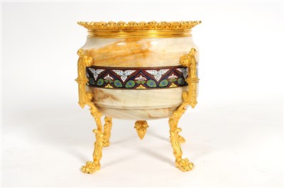 Lot 722 - A decorative French polished onyx jardinière with an enamelled border on ormolu mounts