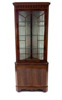 Lot 764 - A reproduction mahogany veneered corner cupboard