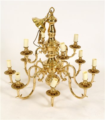 Lot 251 - A large Dutch style brass two tier twelve light chandelier and