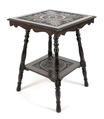 Lot 411 - A Victorian chip carved stained oak two tier occasional table