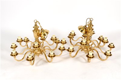 Lot 303 - A pair of brass framed twelve light chandeliers