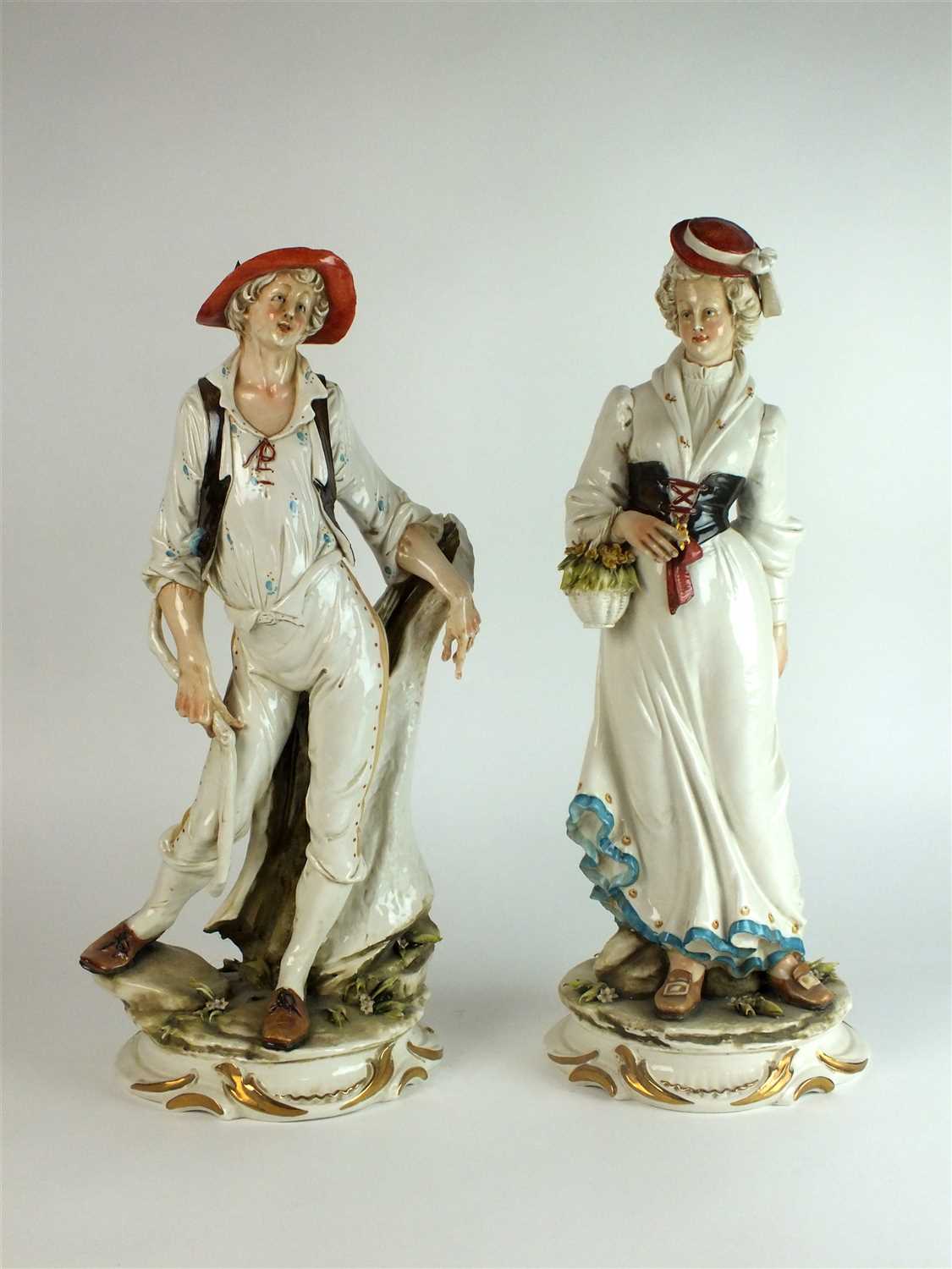 Lot 319 - A large pair of Capodimonte porcelain figures