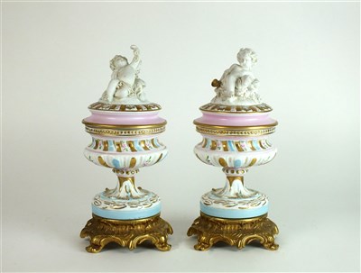 Lot 320 - A pair of Capodimonte jars and covers