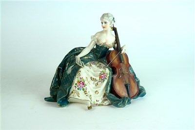 Lot 398 - A Fabris porcelain model of a female cellist