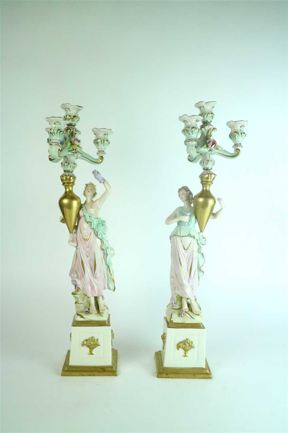 Lot 410 - A pair of Capodimonte porcelain candelabra