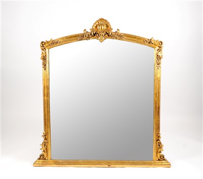 Lot 721 - A large decorative gilt framed over-mantle mirror