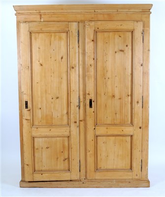 Lot 671 - A large pale scrubbed pine double wardrobe